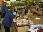 City Market workers check out and bag a customer's groceries.